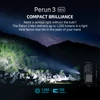 Olight Perun 3 Mini Flashlight beam illuminating a rocky, wooded mountain at night for outdoor adventuring