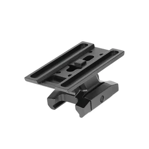 Black metal optical sight riser mount with Picatinny rail clamp isolated on white background