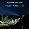 Olight Baton 4 Mini Flashlight 1300 Lumens Beam illuminating Night Outdoors with Size Comparison for Hiking and Camping