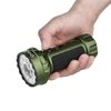 Hand holding a green Olight Marauder Mini 2 flashlight with textured grip isolated on white background