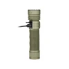 Green tactical flashlight charging via USB cable on white background
