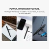 Black pen being charged in various settings: outdoors on a notebook, on a desk next to a phone, and in a car.