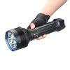 Hand holding powerful black Olight X9R Marauder flashlight with blue accents.