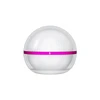 Round white cosmetic cream jar with a bright pink ribbon band on a solid white background