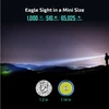 Man with 1000 lumens flashlight on hill, illuminating night landscape with coin and light chip for size comparison.