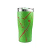 Green stainless steel insulated travel tumbler with red splatter paint design and clear plastic lid isolated on white