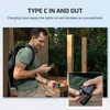 Olight Baton 4/Baton 4 Premium charging case acting as a power bank, charging a phone for outdoor use.