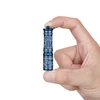 Hand holding a small blue patterned flashlight, white background.