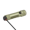Olight green rechargeable tactical flashlight charging with magnetic USB cable on white background