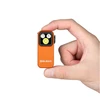 Olight Orange Oclip Pro S held in hand, showing its compact size and integrated bright light for everyday carry.