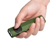 Olight Green ArkPro Lite multi-function flashlight held in hand, showing control dial and dual emitters for everyday utility.