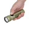 Hand holding Olight Seeker Ultra OD green tactical LED flashlight on white background