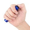 Hand holding a small blue flashlight, thumb pressing the power button.