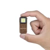 Compact bronze Olight flashlight held in a hand.