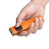 Olight Orange ArkPro multi-function flashlight held in hand, showing control dial, front LEDs, and UV light for versatile use