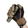 Olight OD Green Warrior Ultra Flashlight held in Gloved Hand showing Tail Switch for Tactical and Outdoor Use