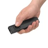 Olight Black ArkPro Flashlight held in hand showcasing compact flat design with selector switch for everyday carry use