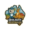 Olight Australia patch featuring cartoon mascot shaking hands with a kangaroo in the outback with Uluru background