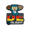 Olight DE PVC patch: cartoon bear with pretzel and gingerbread, German flag design.