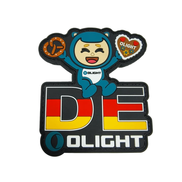 Olight DE PVC patch: cartoon bear with pretzel and gingerbread, German flag design.
