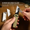Using a mini wrench tool to tighten a screw-secured blade on a gold pocket utility knife for precise cutting.