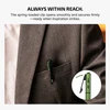 Green pen flashlight with spring-loaded clip secured inside a suit pocket.