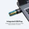 Olight rechargeable keychain flashlight plugged directly into a laptop USB port for charging