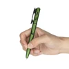 Hand holding a green tactical pen with built in flashlight and bolt action mechanism on a white background