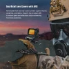 Tactical holographic weapon sight with sacrificial lens covers and ARD mounted on a rifle used by a soldier in a gas mask