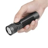 Olight Black Seeker 4 Pro Flashlight Handheld Close-up with Textured Grip and Rotary Switch for EDC and Outdoor Use