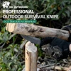 HX Outdoors professional survival knife with DC53 steel blade batoning wood for outdoor adventure.