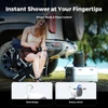 Woman using a portable outdoor camp shower with a rotary switch and hook design to wash her leg next to her SUV