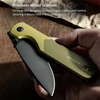 Hand holding a gold pocket knife with precision-milled grooves for enhanced grip, stability, and control.